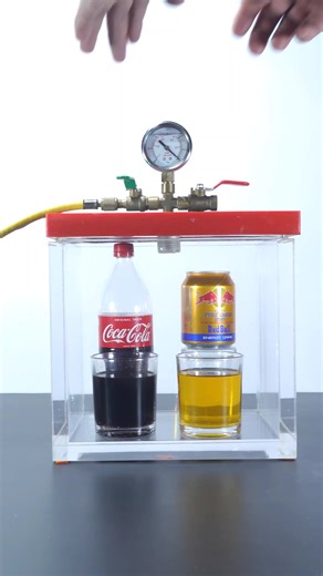 Coke vs Red Bull: Extreme Bubble Reaction in a Vacuum