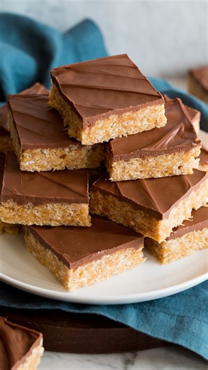 Cooking Classy on Instagram: "Classic Scotcheroos! This dessert wins every time! Crisp, puffy rice cereal is coated in a sweet and sticky peanut butter coating, pressed into bars then covered in a decadent layer of butterscotch and chocolate chips. A nostalgic favorite! This recipe is sure to be a crowd favorite and the best part… it’s super easy to make! Link in bio or at https://www.cookingclassy.com/scotcheroos/ #Scotcheroos #NoBakeBars #PeanutButterChocolate #ButterscotchLovers #ChocolateBut