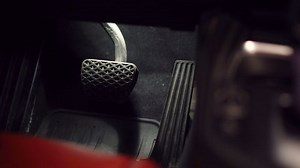 clip-1033766354-man-sit-car-push-on-pedals