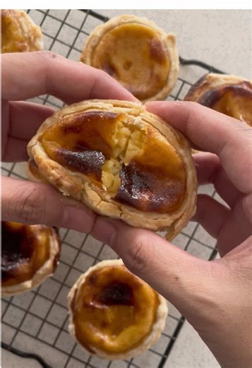 Egg tarts 🥚 Custard Filling Ingredients * 3 large eggs * 135 g sugar *180 ml hot water *180 ml evaporated milk *1 tsp vanilla extract Water Dough Ingredients * 200 g all-purpose flour * 35 g white sugar * 70 g cold water * 40 g vegetable shortening Oil Dough Ingredients * 120 g all-purpose flour * 60 g vegetable shortening Outer Dough: 1. Mix flour and sugar. 2. Add shortening and rub lightly. 3. Add water and mix until a smooth dough forms. 4. Knead lightly. 5. Cover and rest 20 minutes. Oil d