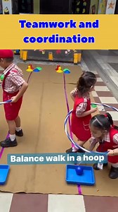 Balance walk in a hoop for teamwork and coordination. #sunriseldh #sunrisenurseryschool #earlyyears #earlyyearseducation #earlylearning #kidsactivities #kidsactivityideas #kidsactivity #grossmotorskills #balance #coordination #hooplachallenge #kids #kidsactivitiesathome | Sunrise Nursery School