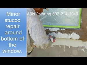 Stucco repair around window.