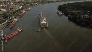 Logistic concept aerial View of maritime transport commercial dockyard with cargo ships, containers waiting to be Upload and Offload Cargo Containers