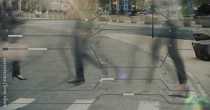 Pedestrians stepping onto crosswalk initiating data overlay across moving legs for tech analysis