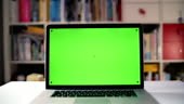 4K table top view of a laptop screen with chroma key. 2 videos with...