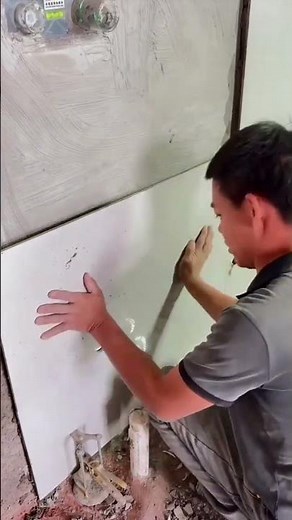 the process of installing rectangular ceramic tiles on building walls #construction #popular #shorts