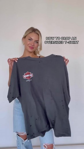 Crop any oversized t-shirt using this simple style hack! ✨ #vintagetee #croptop #stylehack #fashionhack #diycroppedshirt #howtocropatshirt