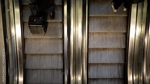Subway moving escalator with moving people up and down direction