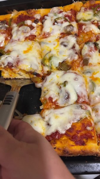 Delicious Rectangular Pizza Cutting and Serving