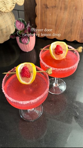 Ashley Tassano on Instagram: "Freezer door raspberry lemon drop 🍋 Ingredients: 750 ml vodka bottle 4 oz fresh lemon juice (fresh lemon juice is important for this recipe!) 3 oz Cointreau 2 oz water *4 oz raspberry simple syrup Pour out about a cup and a half of vodka and save for later. Add the lemon juice, Cointreau, water, and raspberry simple syrup to the bottle. Give it a good shake and place in the freezer for a minimum of 6 hours. Rim your glass with lemon juice, sugar, and crushed freeze