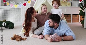 laughing family having fun together at home