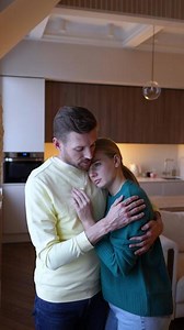 Loving husband consoles crying wife, offering comfort in grief. Strong bond of healthy relationship
