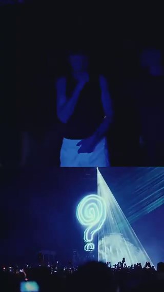 Louis walking on to stage in Milan, Italy