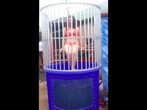 Brunette in Red Bikini Takes a Swim in the Dunk Tank