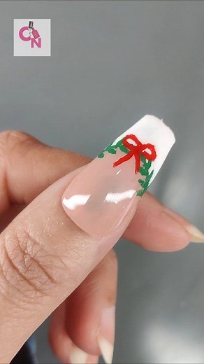 🤍🎄 Watch this elegant Christmas nail art come together—white French tips, a festive green vine & a tiny red bow. Would you try this look? Save & pass it on ✨ #ChristmasNailTutorial #FrenchTipNails #MinimalChristmas #FestiveNails #HolidayManicure #NailArtReel #fblifestyle | Crazy Nailzz - The Nail Art Studio