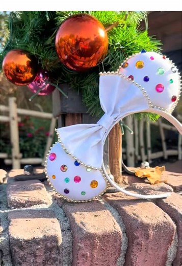 These Snow White Mine Train jewel ears are pure fairytale sparkle 🍎✨ Inspired by classic princess magic, they feature dazzling jewel details that shine beautifully in the light. Perfect for park days, photos, and Disney girls who love elegant statement ears. Shop now through the link in my bio and bring a little storybook magic with you 🤍✨ #snowwhite #minnieears #disneyadult #disneyaccessories #mickeyears