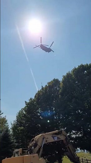 CH-47 Chinook helicopters fly over Orchard Beach State Park