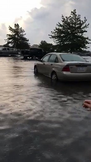 This viewer video shows the parking lot of an Elizabeth City Walmart flooded after a downpour early Wednesday evening. The lot flooded in about 20 minutes, but it didn't affect the store's normal operations. (📹: Wesley Lill Dixie Forbes) wtkr.com/weather | WTKR News 3