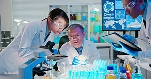 clip-1043045371-asian-scientist-team-meeting-writing-analysis-results