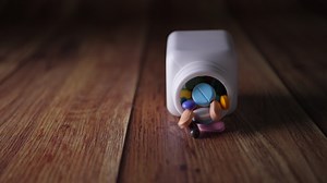 Download Slow motion of Medical pills bottle falling on floor for free