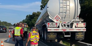 TROOPERS:  Gasoline tanker rode bridge top rail entire length of span
