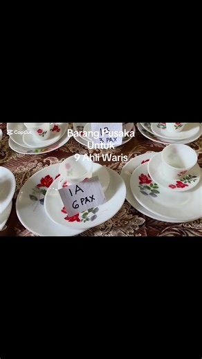 #barangpusaka This is a collection of vintage JAJ Pyrex 'June Rose' dinnerware sets. This pattern features red roses and green leaves on a milky white opal glass background. The dinnerware was produced by JAJ Pyrex in England, from the 1960s era. The pieces are made of tempered opal glass and are typically safe for microwave and oven use.