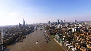 London City Skyline Aerial View feat. Famous Iconic Landmarks Skyscrapers Flying Over Thames River and Tower Bridge in England, United Kingdom 4K Ultra HD