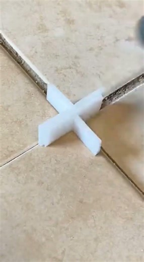 Repairing cracked floor tiles.