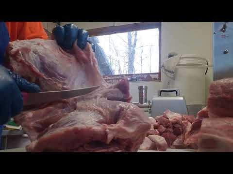 Removing the coppa from a boneless pork butt