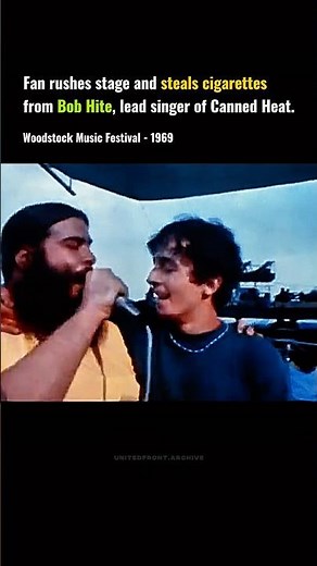 A fan shares a moment with Canned Heat at Woodstock (1969)