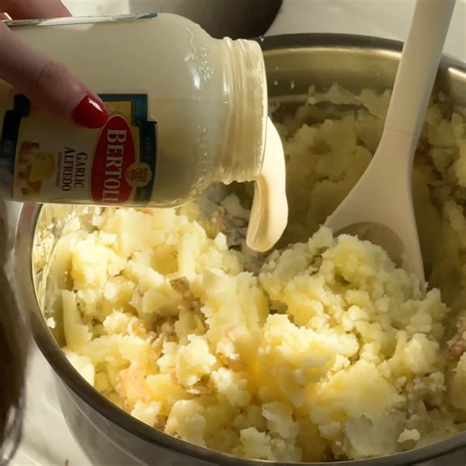 Not just for pasta. Bertolli® Garlic Alfredo Sauce made with fresh cream and real butter elevates potatoes | Bertolli