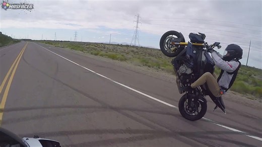 German motorcycle operator demonstrates advanced wheelie technique and control