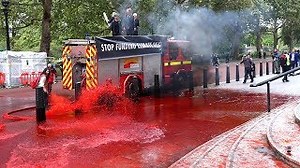 Extinction Rebellion spray fake blood on Treasury building as police arrest eight for criminal damage