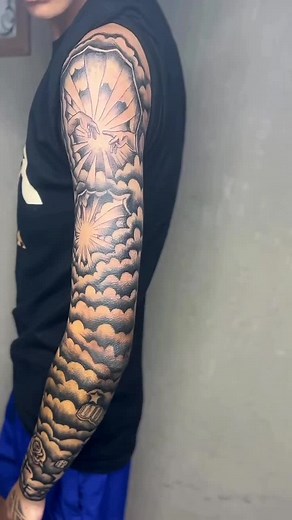 Stunning Black and Gray Clouds Arm Sleeve Tattoo by Briitto