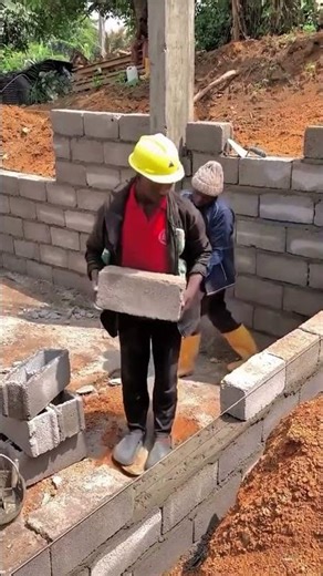 It's very funny to see workers like robot mechanics carefully installing concrete blocks #shorts