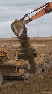 Loading CAT Scrapers with an Excavator #dirtworld #scrappers #excavators | Aaron Witt