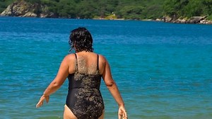 clip-1022703805-beautiful-chubby-middle-age-woman-on-beach