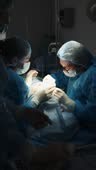 The plastic surgeon and the assistant perform blepharoplasty surgery.