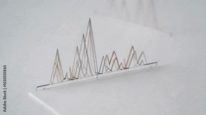 Paper Model of a Multi-Line Graph on a White Background