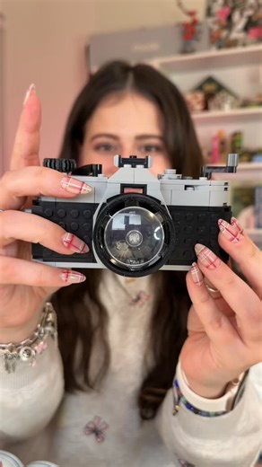 MaybeHeilly on Instagram: "well isn’t this the cutest lego EVER?!📷✨🥹 it’s gonna look so good next to my real cameras🕺🏻✨ honestly, building legos in the middle of the night is always a vibe✨ @lego #iphone17promax #lego #iphone"
