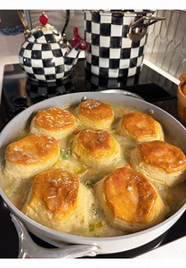 Making a biscuit topped chicken pot pie right on the stovetop in my checkered kitchen