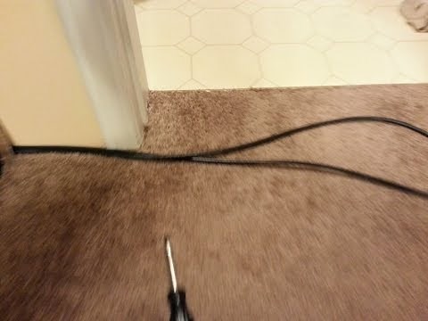 How to hide wires under the carpet