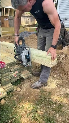 How to cut and set a deck post using post protectors for ground contact
