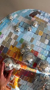 This round, 750-piece stunner — painted by Ashley Treece and finished in holographic shine — SOLD OUT IN DAYS. Just restocked. Just as dazzling. Piece together the party. | Piecework