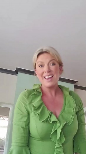 Elegant Green Ruffled Blouse for Home Settings