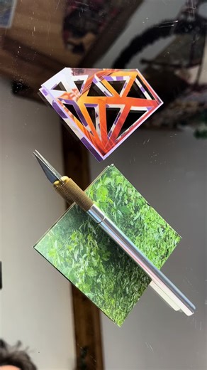 With delicate blade, I trace the diamond’s edge, Handmade paper yields to PaperCutout pledge. Sharp facets emerge in VibrantArt gleam, BoldColors sparkle, a PaperCraft dream. From flat sheet to gem, inspiration ignites, A glittering heart in AbstractArt lights. In the studio glow, handmade paperart unfolds, Diamonds of light in artcollage bold. CollageArt dances with PaperCutout grace, AbstractArt whispers in MixedMediaArt space. VibrantArt bursts with ColorPop delight, PaperCraft hearts in Bold