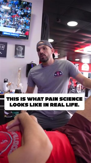 This is what pain science education looks like in real life. Not a podcast soundbite that sounds smart. Not a dissertation about central sensitization that is over their head. Not a provider explaining that pain doesn't equal damage from a zoom call... This. An engaged clinician, treating, having a real, genuine, conversation while delivering care. Explaining what the treatment is and isn't doing... Explaining what adaptations would be favorable to train for... Explaining what we're going to do 