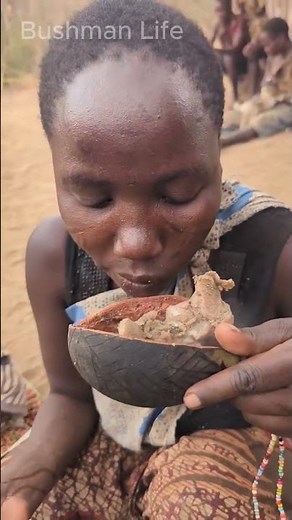 Hadzabe Women Enjoying Traditional Food in Nature, Sharing with the Tribe