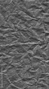 Crumpled paper texture stop-motion animation. Ideal for creative projects requiring an authentic, rustic paper backdrop for presentations or design