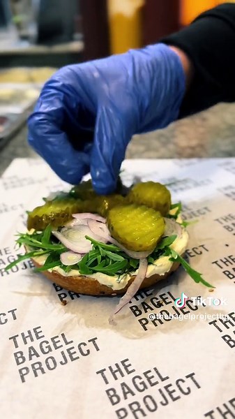 The Ultimate Salt Beef Bagel: Savory Delight with Cream Cheese, Rocket, Pickles, and More!